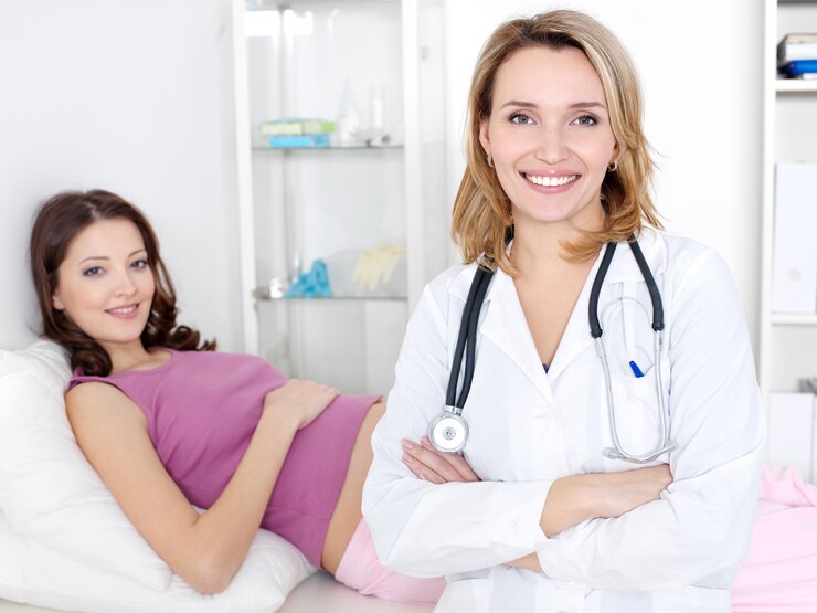 smiling doctor young beautiful pregnant woman hospital indoors